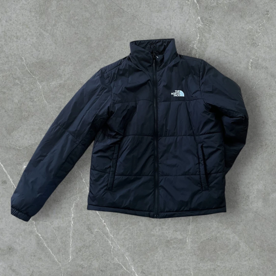 Svart pufferjacka från The North Face
