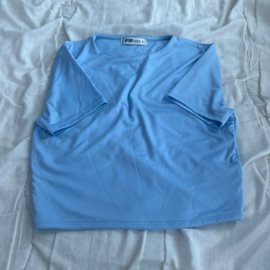 Ljusblå topp från FB Sister