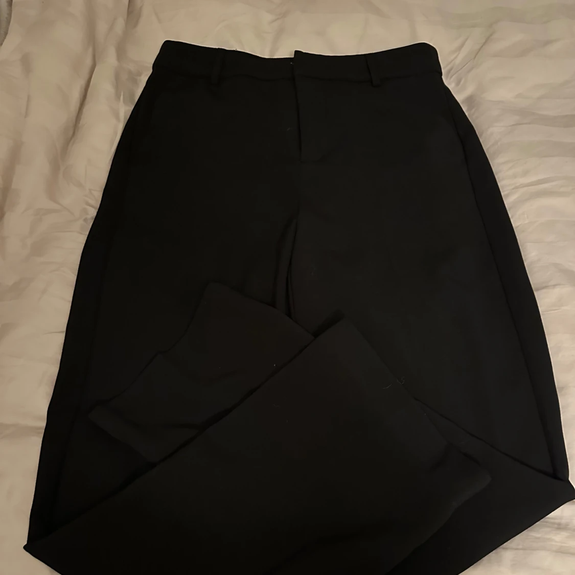 Svarta kostymbyxor
