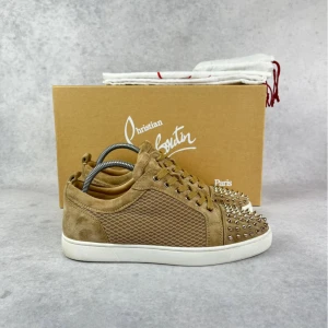 Christian Louboutin junior spike sneaker - – Condition: 9/10 - flawless  – Color: Beige  - What is included: Box & dustbag  – Retail price: 9000 + SEK