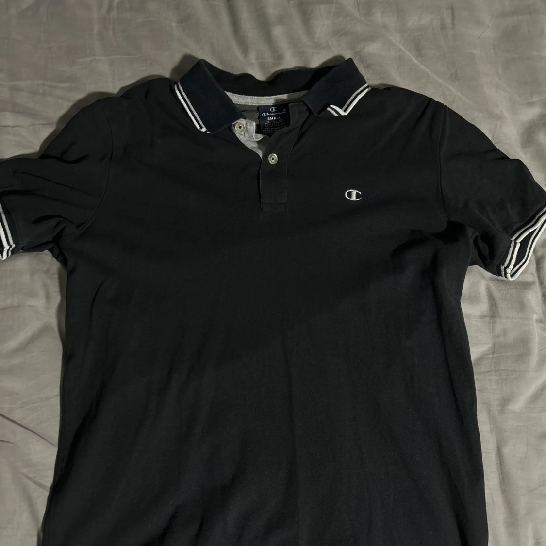 Svart pikétröja från Champion