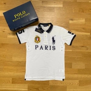 Ralph lauren Paris shirt - ✅ Polo Ralph lauren chief keef shirt Paris. (R€p)  📊 Colour: White and navy blue  📏 Size: Small (S) (please seek measurements for reassurance)  📐 Measurements: Pit to pit – 48cm Collar to hem – 66cm  ♻️ New. Not worn.   💬 If you got any questions don’t hesitate to  ask!   I ship on the same day or the next day🤝  💰 Im also open for resonable offers - feel free to make one✌️