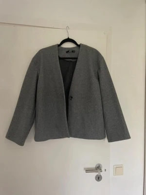 Grå kappa - Använder ej