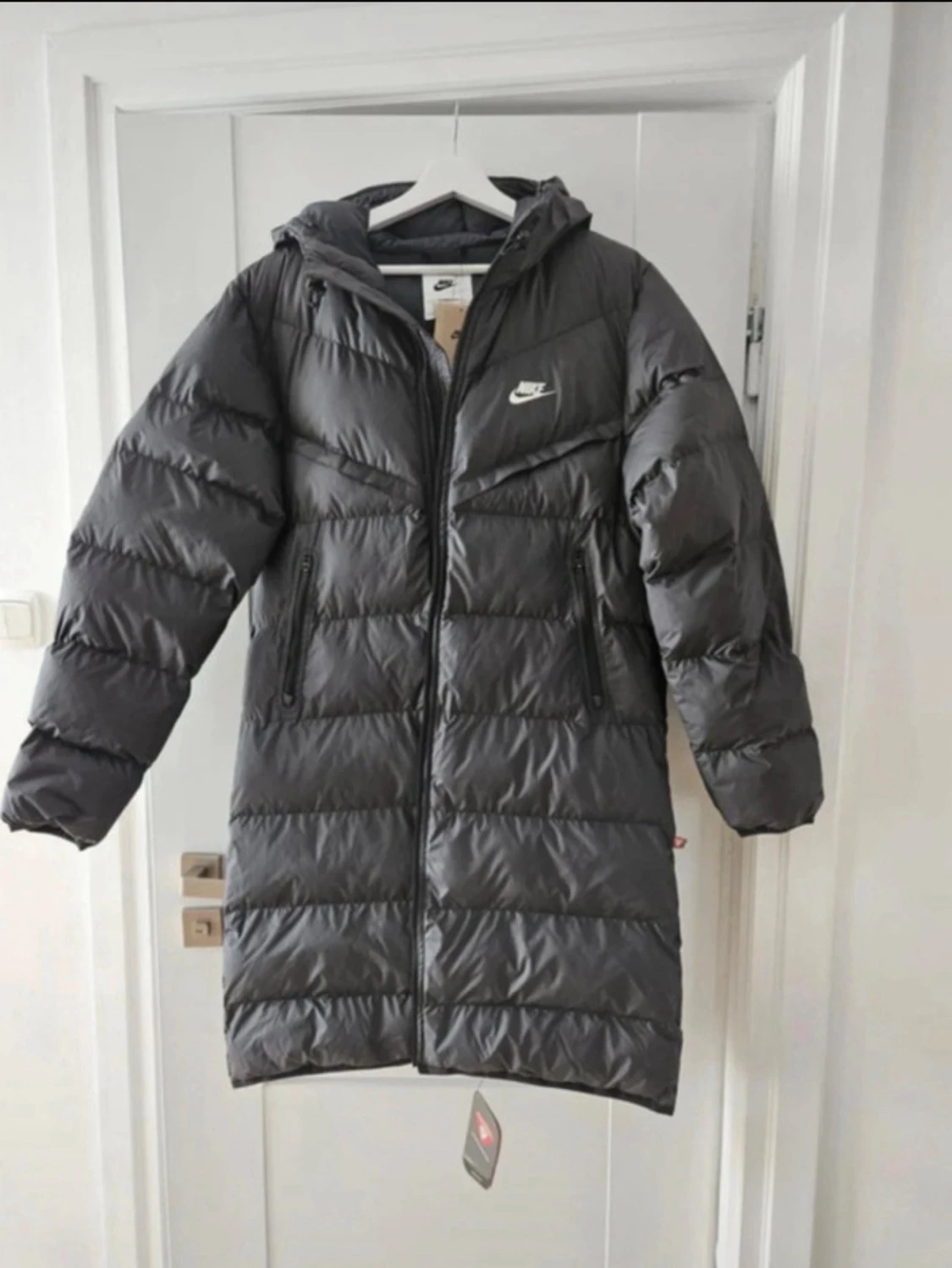 Svart lång dunjacka från nike 