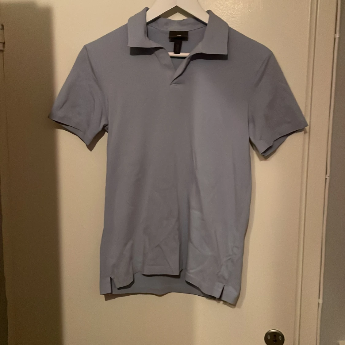 Ljusblå pikétröja från H&M XS