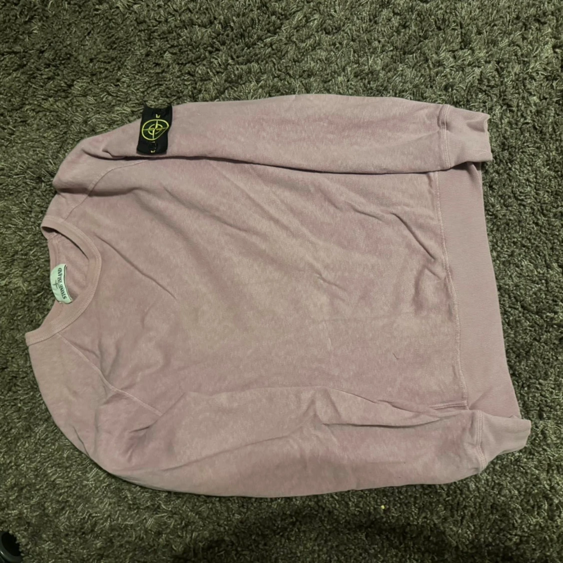 Ljusrosa Stone Island sweatshirt