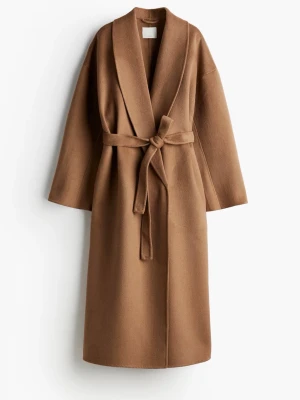 Brun kappa i ullmix  - Säljer en snygg brun kappa från H&M i ullmix i storlek L men passar mig som är M, den sitter overzied. Ny pris är 2000kr säljer för 1200kr. Pris går att diskutera! 