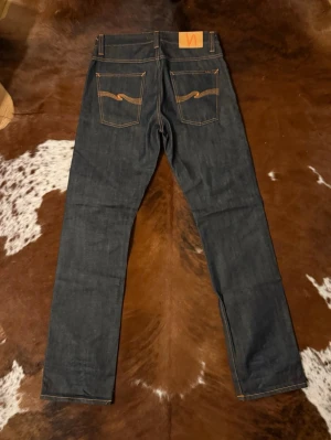 Vintage Selvage Nudie AvrageJoe - Tjena! Kollar vad jag kan få för dessa extremt sällsynta helt otvättade DrySelvage AvrageJoe, byxorna är som nya utan lappar, W31/L34, kom med bud!