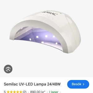 Semilac UV-LED Lampa 24/48W - Semilac UV-LED Lampa 24/48W är en kraftfull nagellampa med modern design. Perfekt för härdning av gel och gelpolish. Flera timerinställningar och hög effekt ger snabb och jämn härdning. Lampan ser ut att vara i mycket gott skick utan synliga defekter.