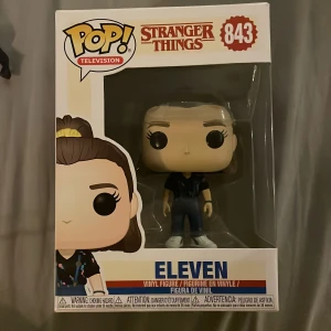 Eleven (Stranger Things) Pop! Television #843 - Cool Pop! vinylfigur av Eleven från Stranger Things – perfekt för fans av serien! 