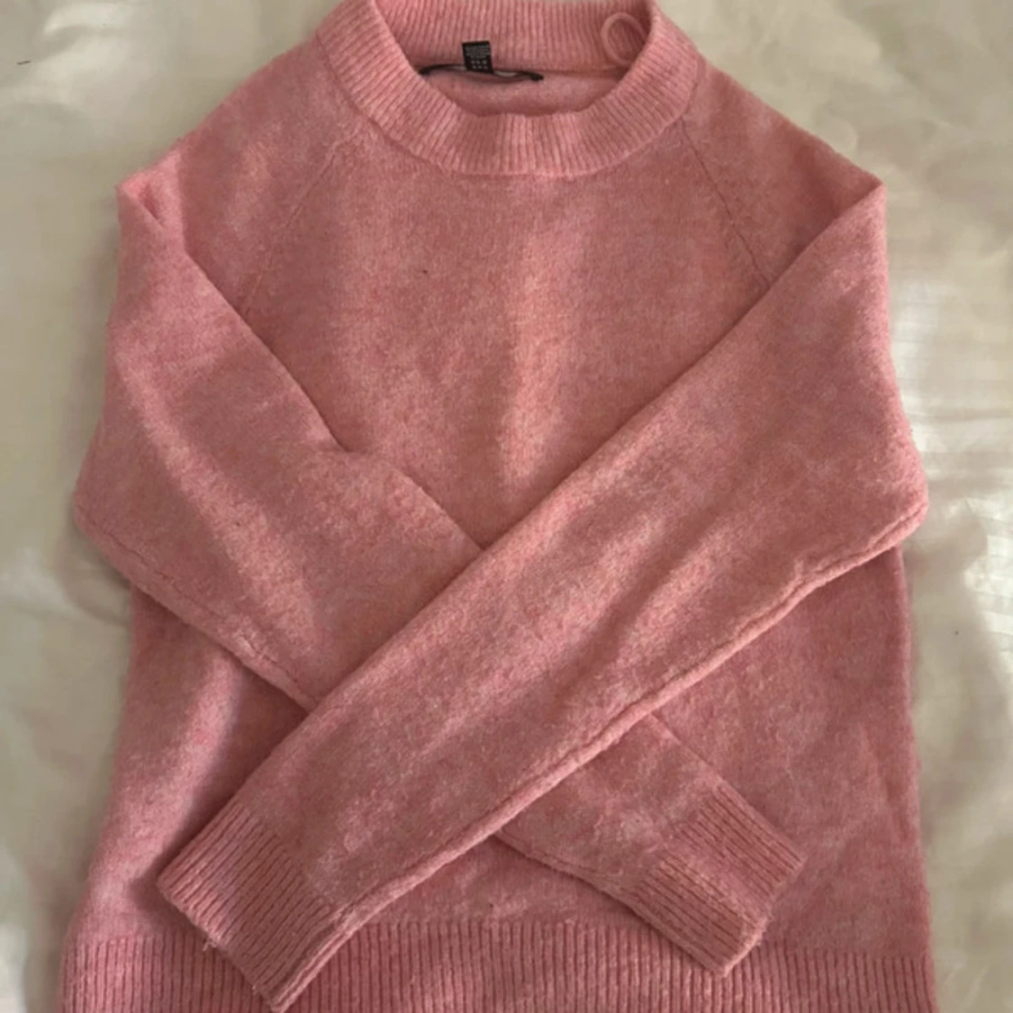 Rosa stickad tröja