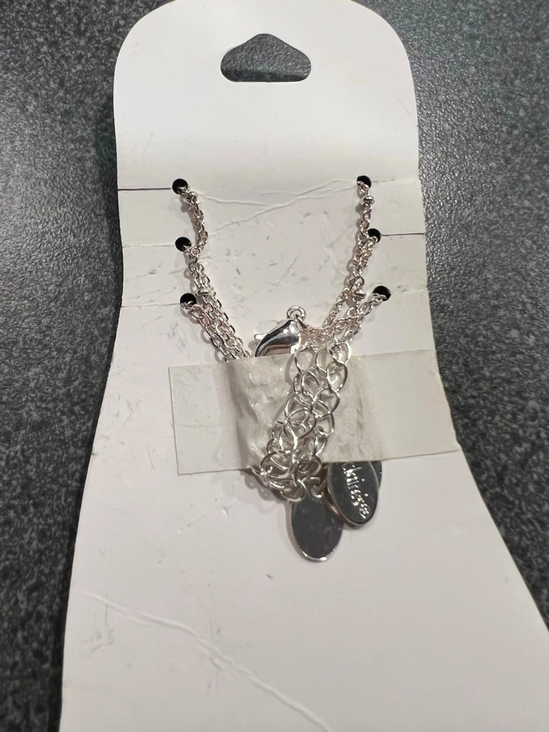 Silverigt fot armband onda ögat från Claire's - 4