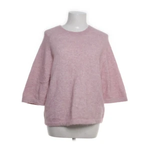 Ljusrosa fluffig stickad tröja - Passar S och Xs.
