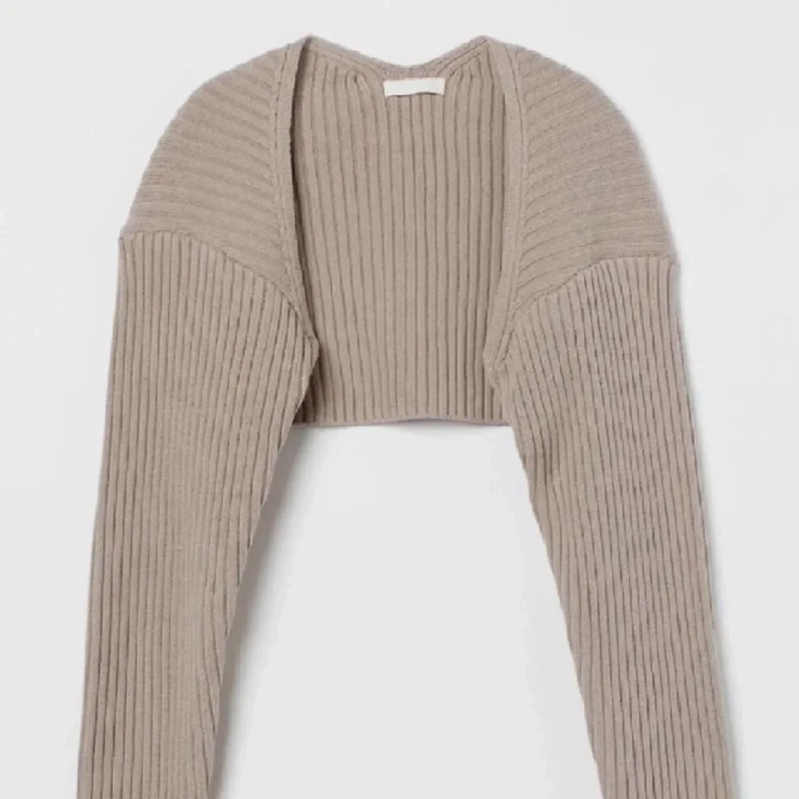 Beige croppad ribbad kofta bolero