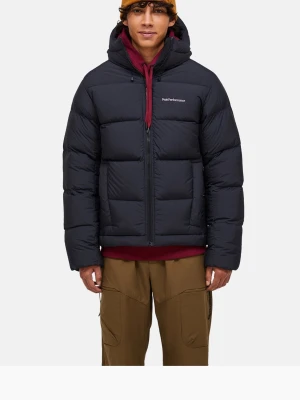 Svart dunjacka från Peak Performance - Säljer en svart dunjacka från Peak Performance med huva och dragkedja framtill. Jackan har en puffig design och logga på bröstet. Perfekt för kalla dagar och enkel att matcha med olika outfits. Nypris 4500 kr, tags finns kvar