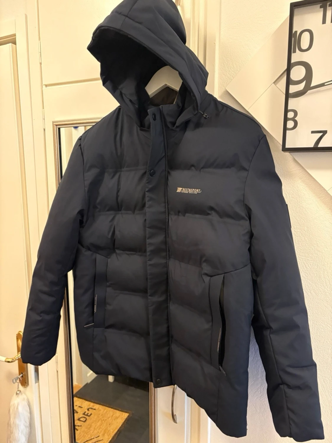 Mörkblå pufferjacka med huva - 1