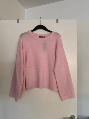 Stickad tröja rosa  - Storlek XL. Aldrig använd. 