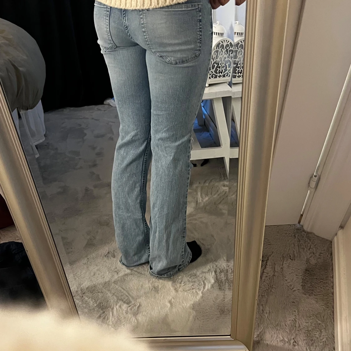 Ljusblå slitna bootcut jeans - 1