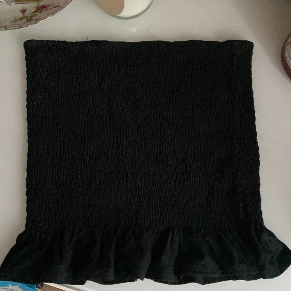 Ärmlös topp med volang