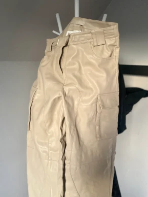 Cream faux leather cargo pants - New, size EU 38/M, true to size