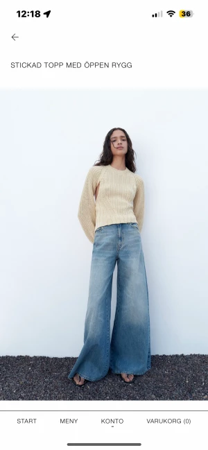 Stickad kort topp - Stickad kort topp med öppen rygg, helt ny ej använd , mitt pris 200kr + frakt