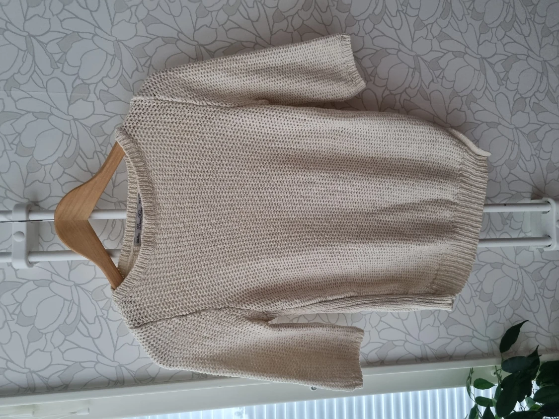 Asymmetric cut sweater in size S
