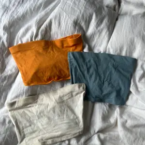 korta tubtoppar i orange, blå och vit. i storlek xxs-s. säljer alla för 79