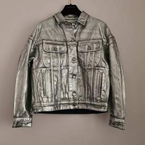 Acne Studios silver denim jacket in new condition.  Amazing silver treatment on the denim. Bought at sample sale, so there is a pen mark in the label in neck (ask for more photos, can only upload 3 here).  New condition with hang tag on