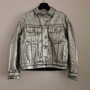 ACNE STUDIOS DENIM - Acne Studios silver denim jacket in new condition.  Amazing silver treatment on the denim. Bought at sample sale, so there is a pen mark in the label in neck (ask for more photos, can only upload 3 here).  New condition with hang tag on