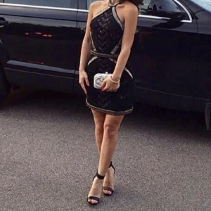 Svart klänning med paljetter - Storlek 34