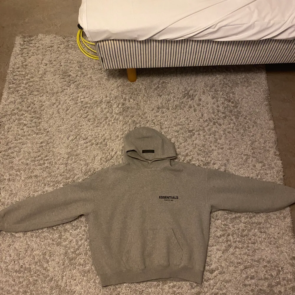 Grey essentials hoodie size M no holes or rips washed and no stains. Hoodies.