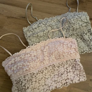 Toppar - Fina toppar, bh,ar i spets. Axelbanden går att justera.