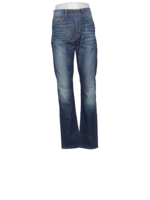 Edwin bootcut/slim jeans - Snygga blå Edwin bootcut/slim jeans med slitningar och tvättade detaljer. Klassisk femficksmodell med orange sömmar och knappgylf. Jeansen har en avslappnad passform och är tillverkade i denim, perfekt för en cool och avslappnad stil.
