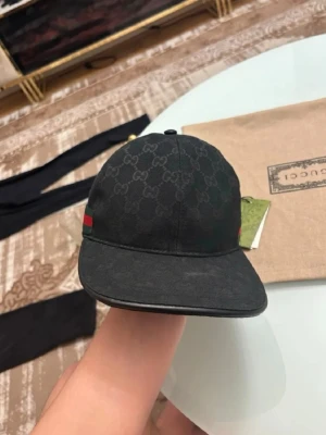Svart keps från Gucci med GG-mönster - Helt ny. 58cm