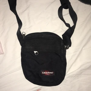 eastpak fanny pack - black small fannypack with 1 main pocket and 2 small ones