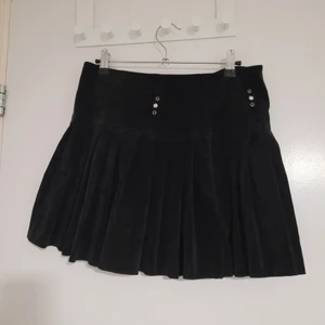 Mini black velvet skirt. - The skirt  is used but has no flaws. really cute mini black velvety skirt.