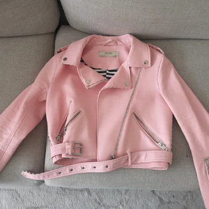 Zara pink leather jacket | biker jacket - Size M, very good condition zara leather biker jacket. It isn't full length - cropped, ends at mid section. That's why I'm selling, it's too short for me. Has really cute black and white stripe pattern inside. Pretty thick jacket. 