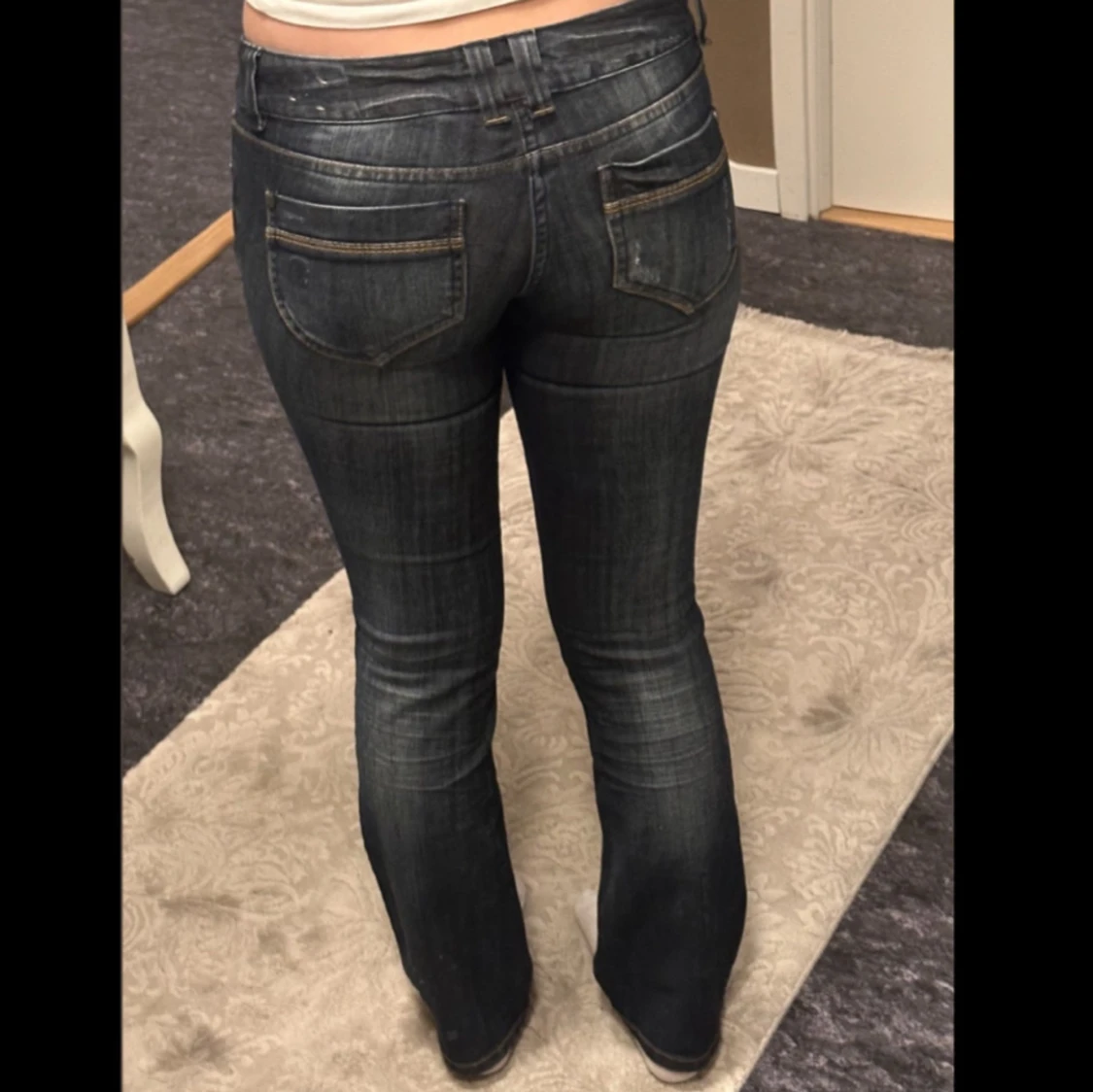 Ultra low-rise mörkblå bootcut jeans