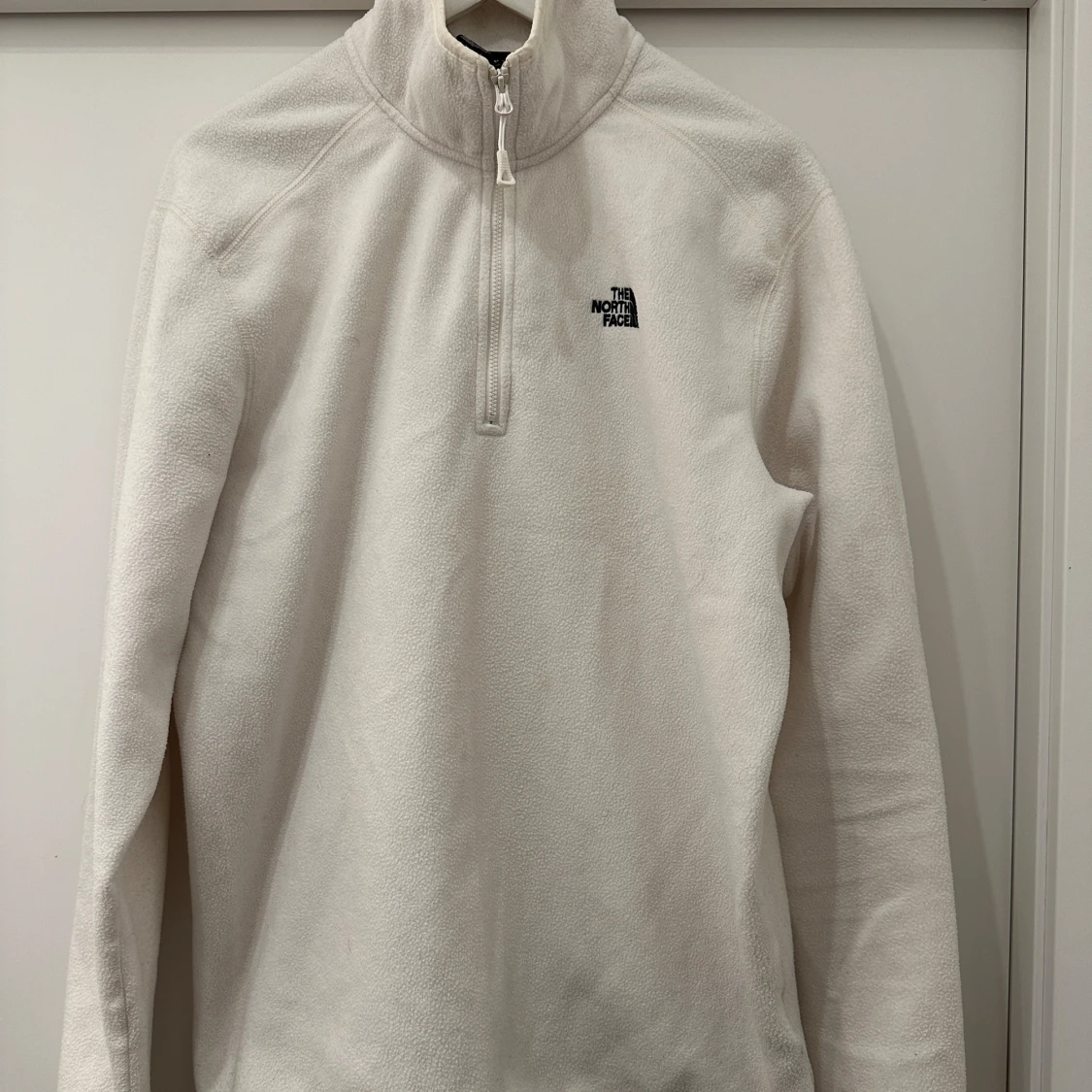 Vit fleece half zip från The North Face