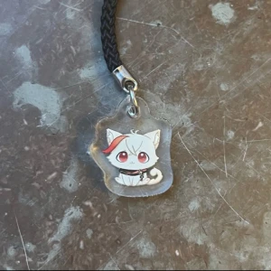 Genshin impact Kazumeow phonecharm - Phonecharm of Kazuha as a cat from Genshin impact! Perfect for your phone decorations or collection :)  (There might be scratches on the surface but that’s only on the protective layer of plastic, peel it off on both sides and it’ll be perfectly shiny!)
