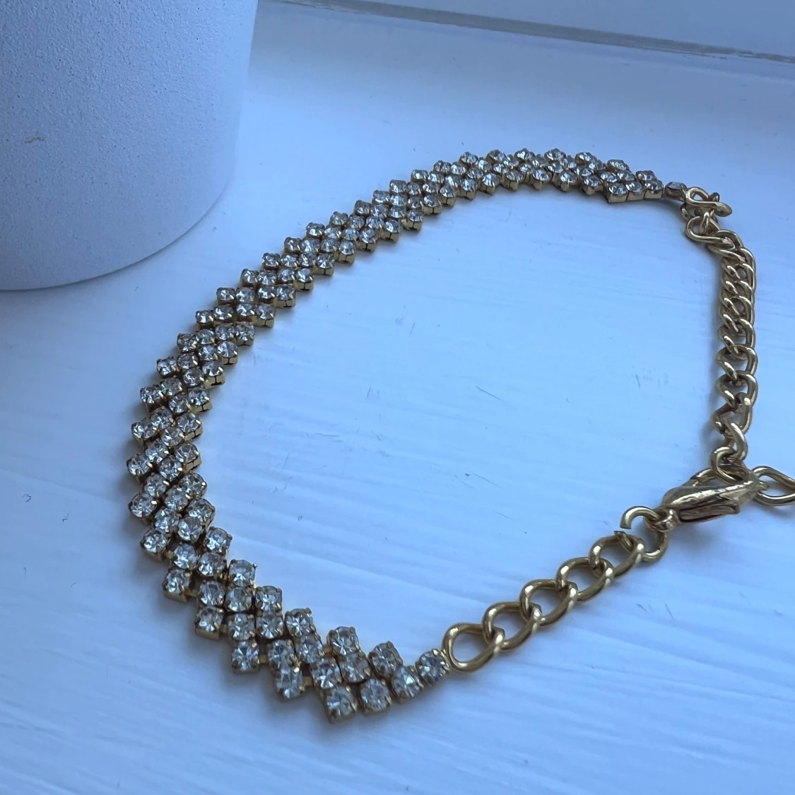 Glittrig fotlänk i guldfärg - 2