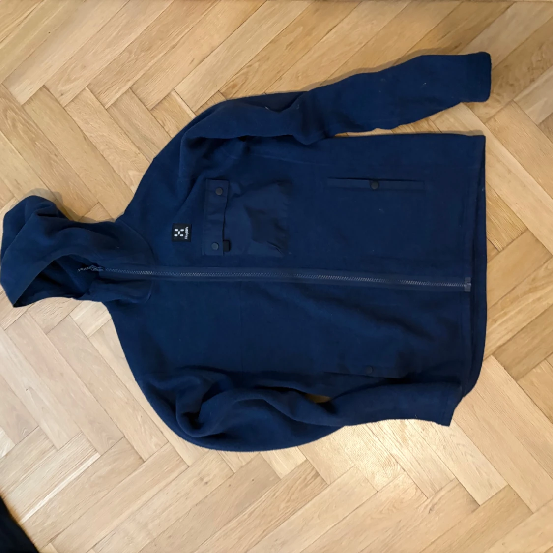 Blå fleecehoodie från Haglöfs