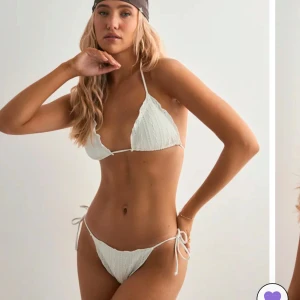Vit bikini med snörning - Supersnyggt vit bikini sett från Nelly säljer då de är för litet , aldrig använd , prislapparna är kvar. Skriv vid mer frågor eller egna bilder ( nypris för båda är 350)