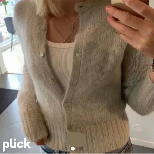 Grön stickad kofta - .