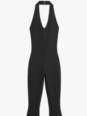 Svart halterneck jumpsuit - Snygg svart jumpsuit med halterneck och djup urringning. Tight passform upptill och utsvängda ben ger en trendig siluett. Från Zara köpt förra sommaren i strl S. Använd fåtal gånger inga defekter osv.