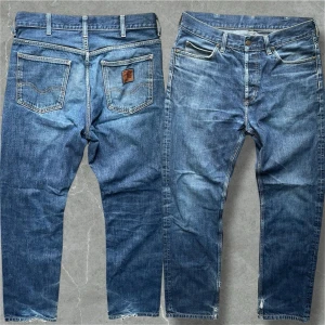 Vintage Carhartt Jeans - Snygga Carhartt jeans med straight passform och i storlek 31/32. Jeansen har lite slitningar men fortfarande i bra skick! Modellen är 183cm. Midja 40cm, Längd 104, Benvidd 19cm