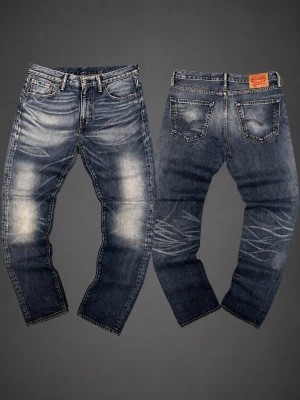 Blå Levi's jeans med slitningar - Lite bootcut W31-L32