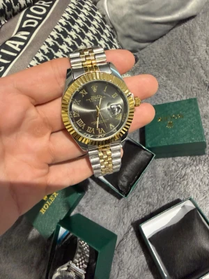 Gold and black rollie watch - Brand new got the plastic. Never used