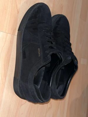 Axel Arigato skor svarta herr  - .