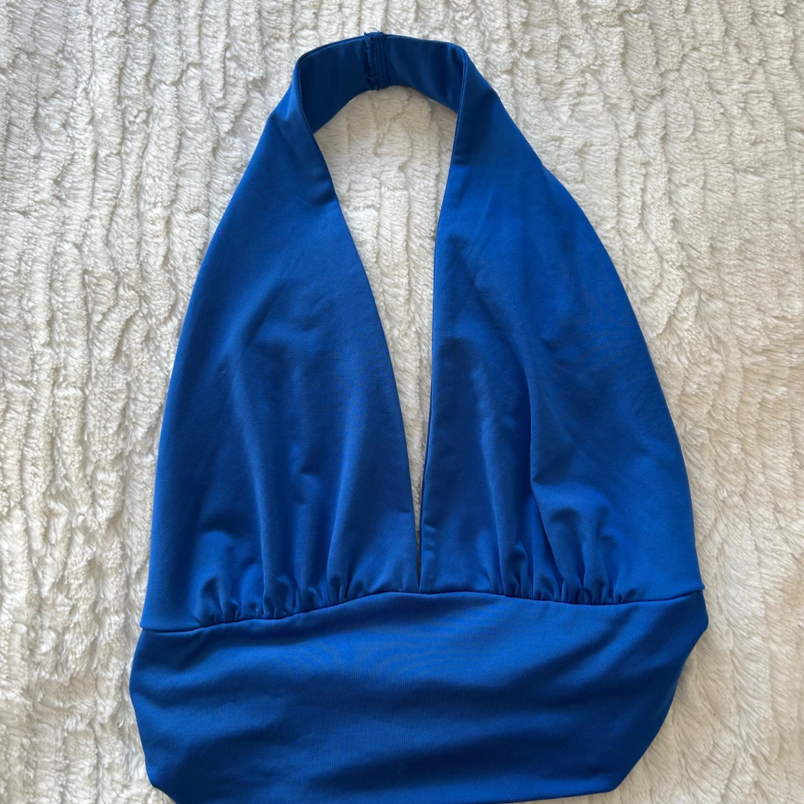 Blå topp v-ringning